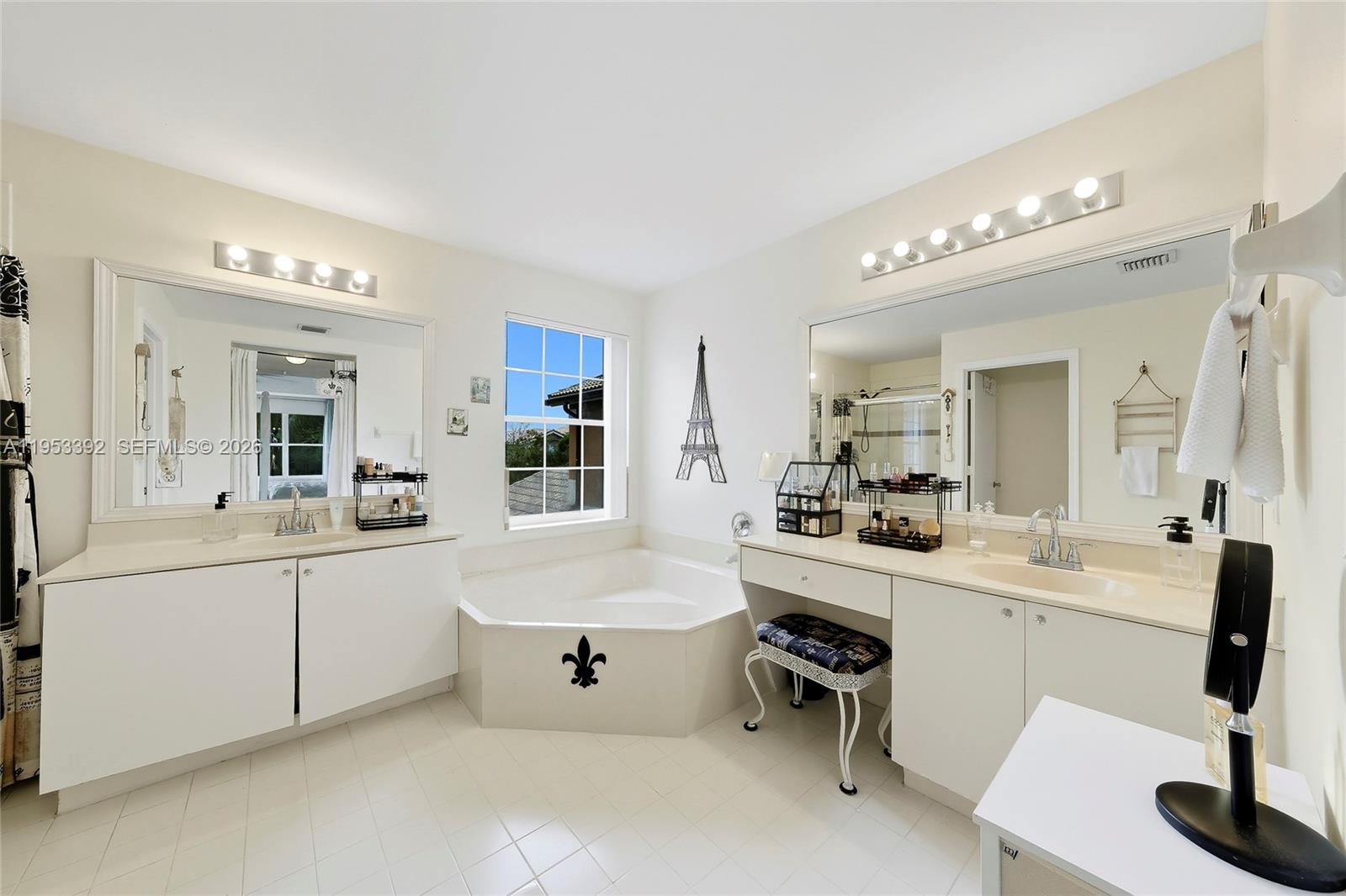 15025 Southwest 19th Court Miramar, FL 33027 - Photo 15 of 27 a large white bathroom with a large tub and sink