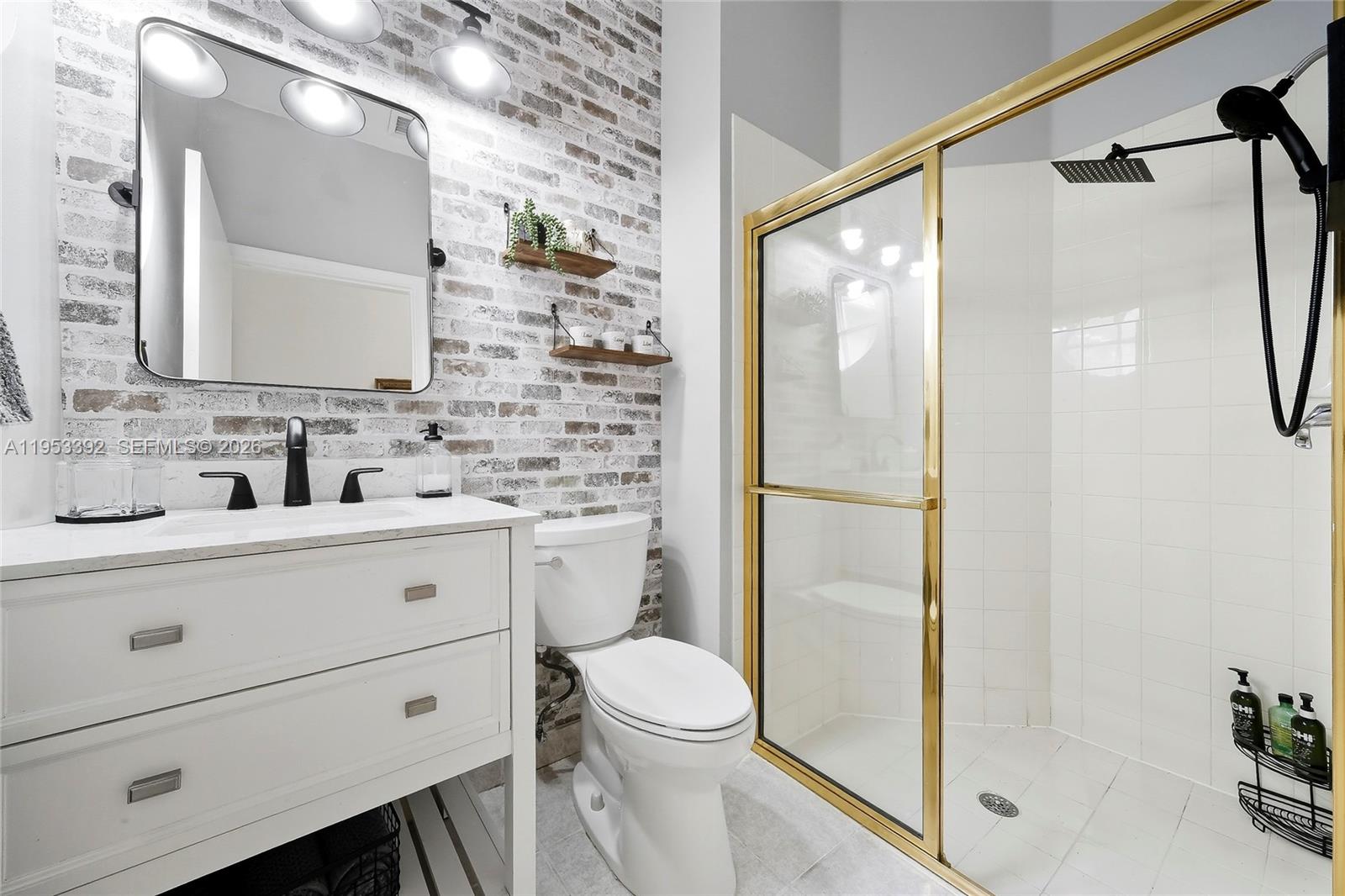 15025 Southwest 19th Court Miramar, FL 33027 - Photo 8 of 27 a bathroom with a sink a toilet and shower