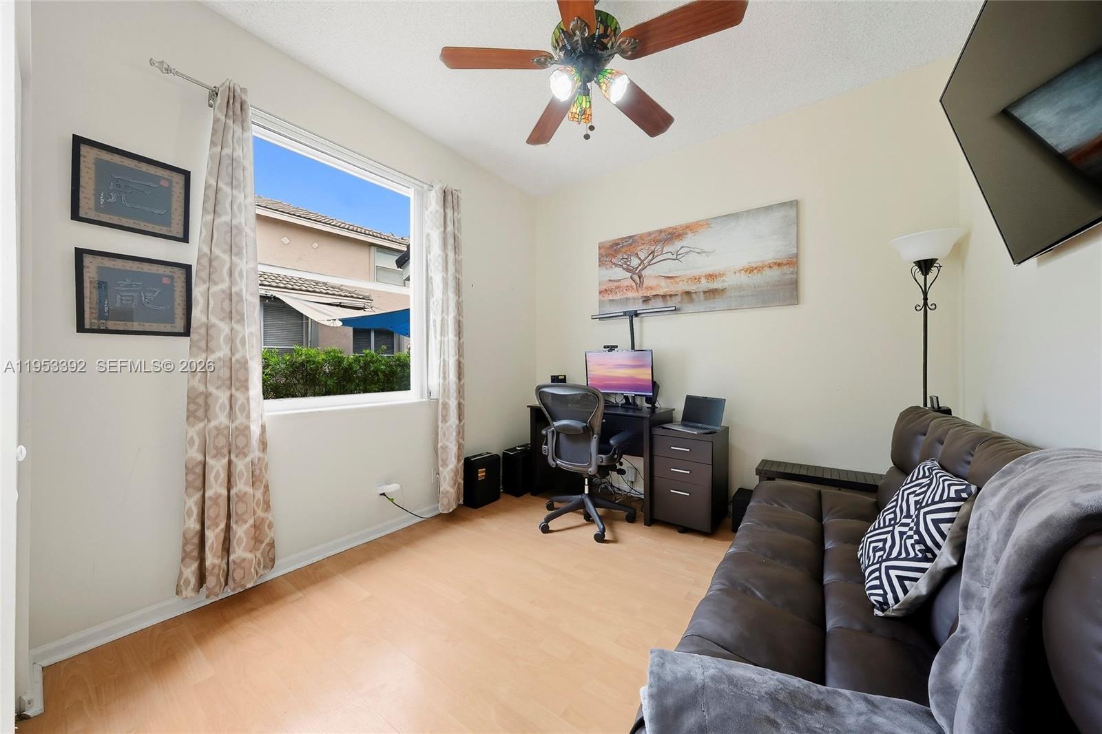 15025 Southwest 19th Court Miramar, FL 33027 - Photo 9 of 27 a living room with furniture and a flat screen tv