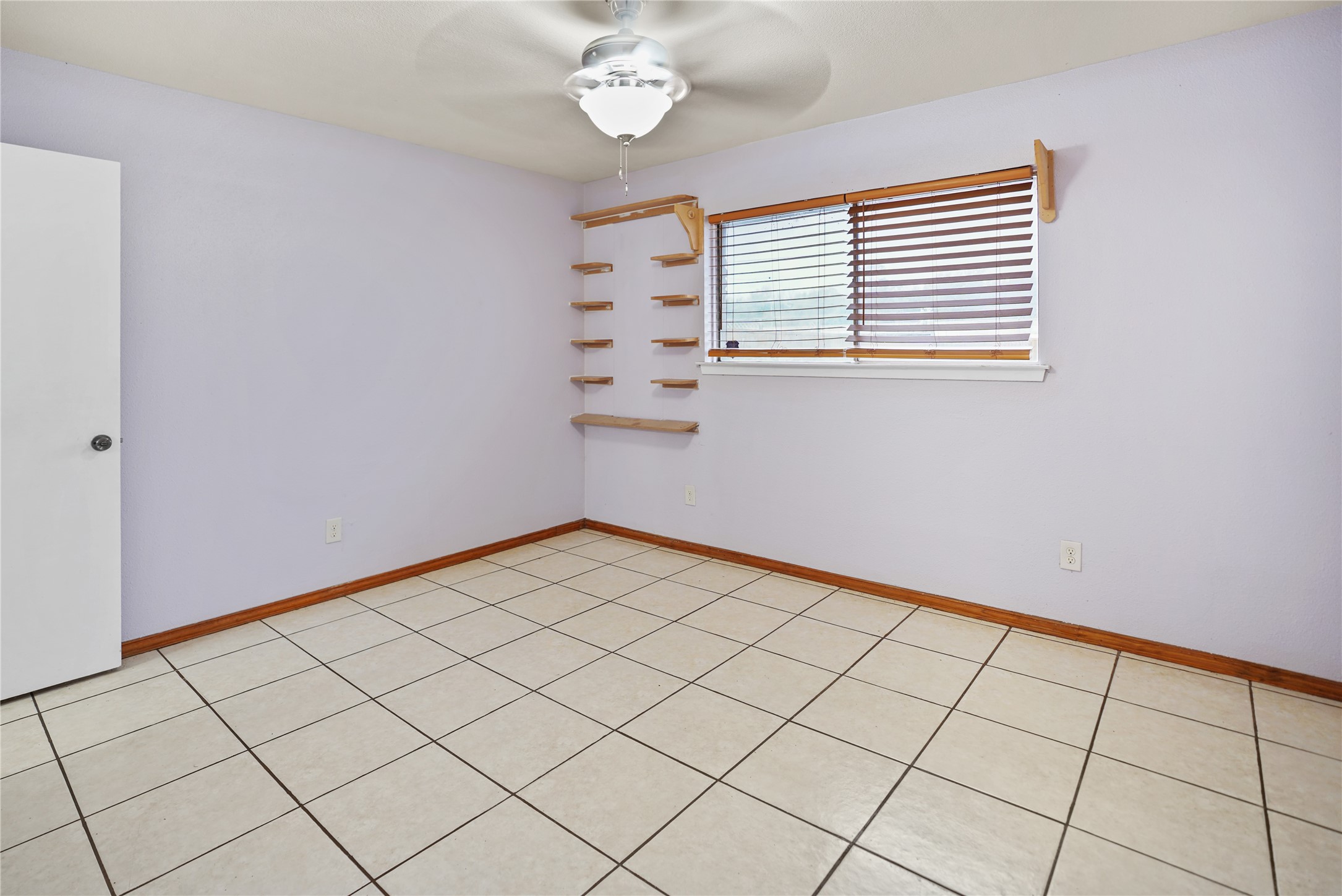623 Rockbrook Drive Houston, TX 77015 - Photo 12 of 17 a view of an empty room and chandelier fan