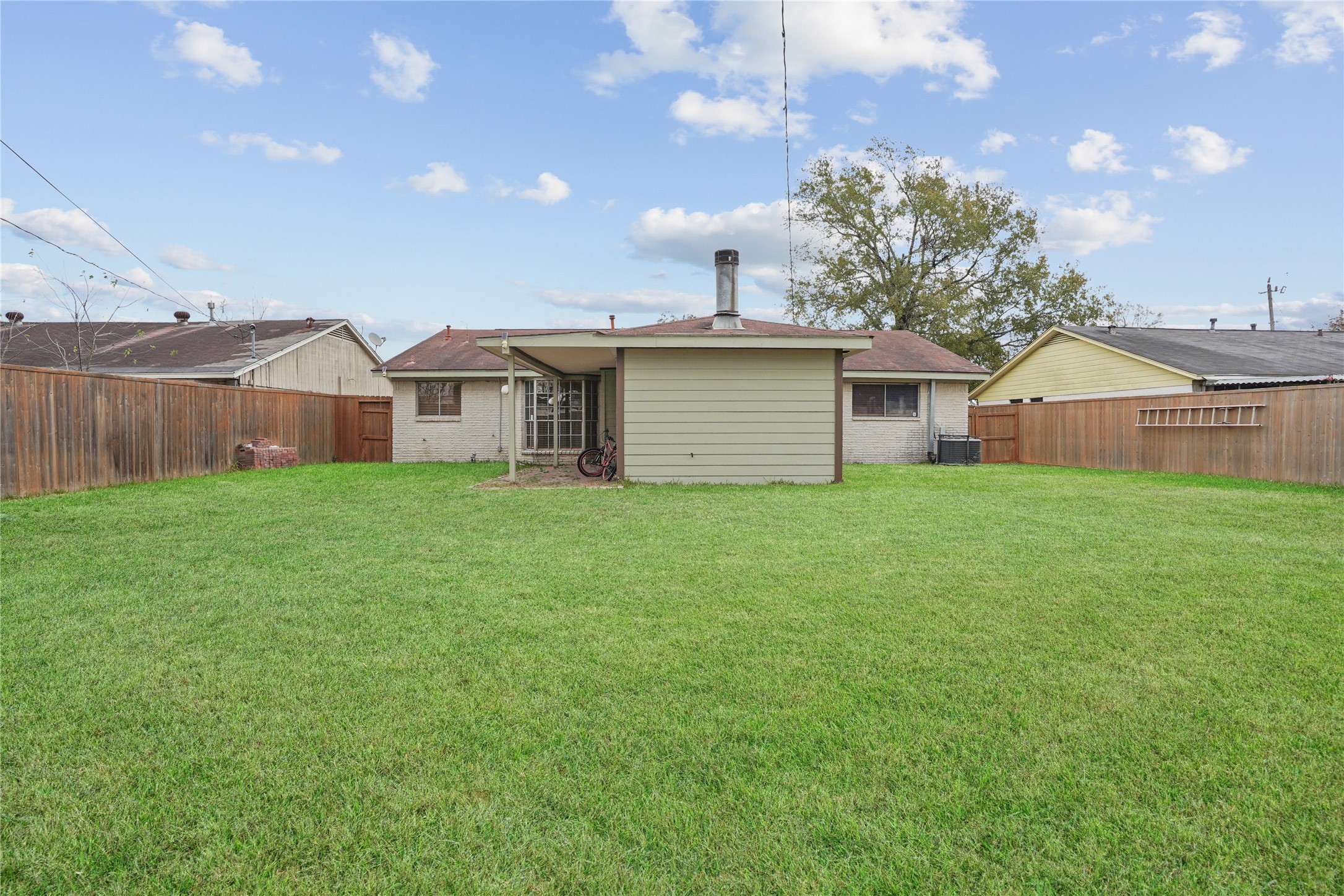 623 Rockbrook Drive Houston, TX 77015 - Photo 16 of 17 a view of a house with a yard and a large tree