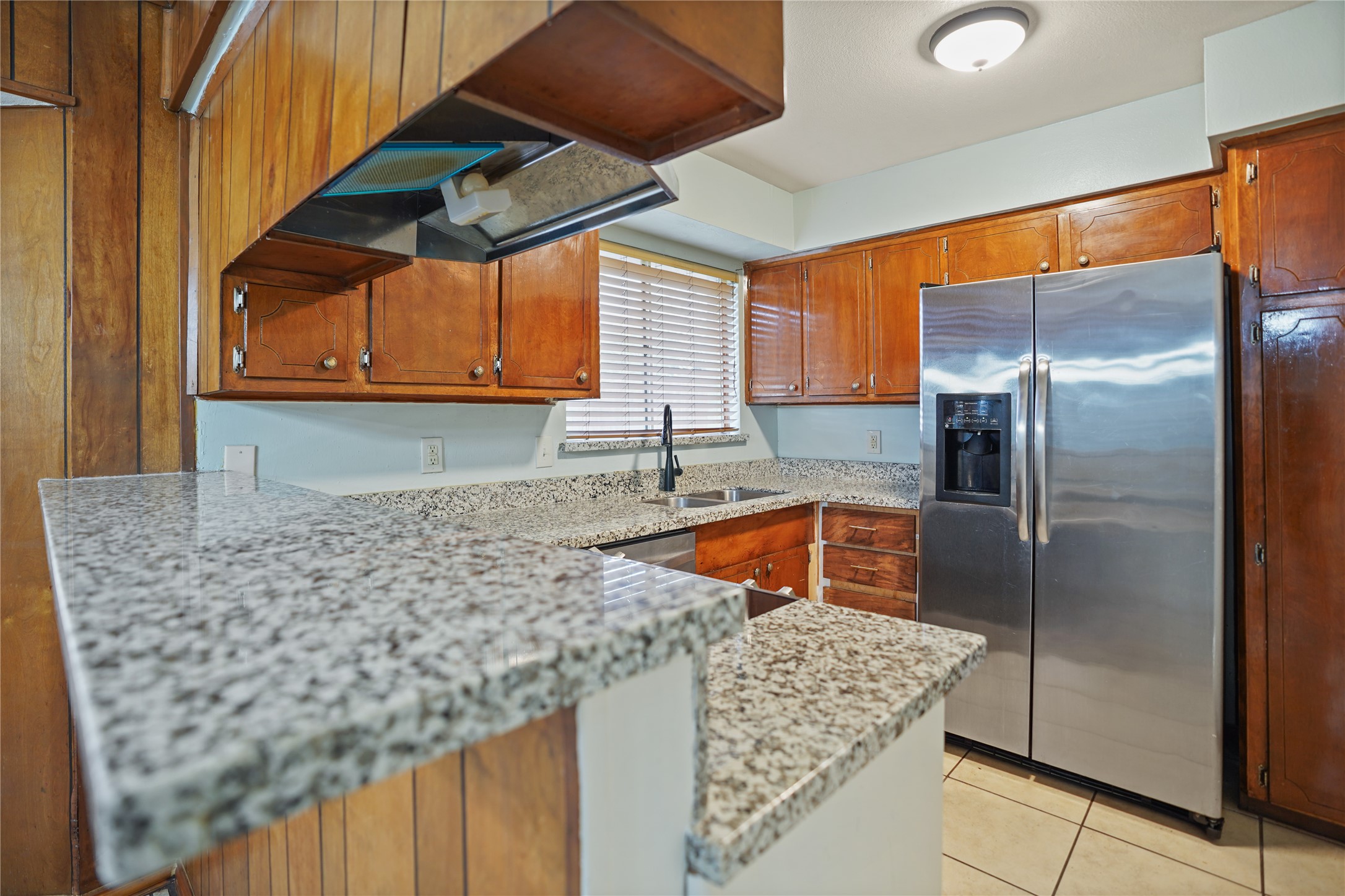 623 Rockbrook Drive Houston, TX 77015 - Photo 6 of 17 a kitchen with stainless steel appliances granite countertop a sink and a refrigerator