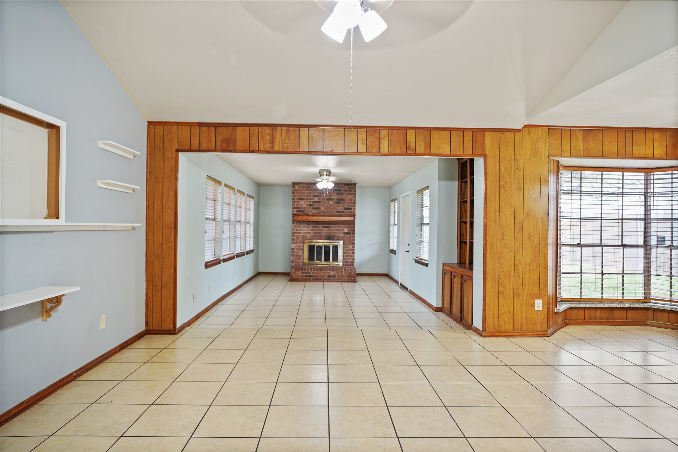 623 Rockbrook Drive Houston, TX 77015 - Photo 8 of 17 a view of a livingroom with a flesh screen tv and windows