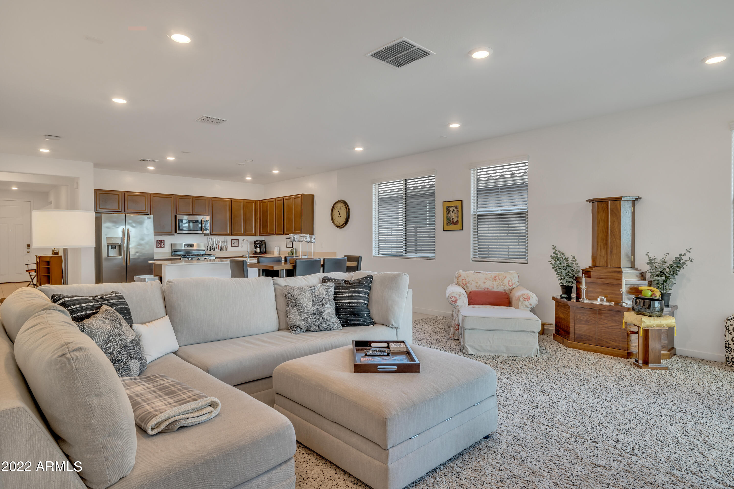 9630 West Atlantis Way Tolleson, AZ 85353 - Photo 14 of 37 a living room with furniture kitchen view and a large window