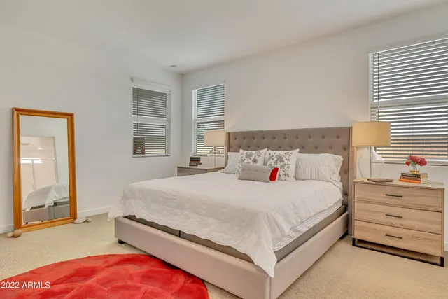 a bedroom with a bed and a dresser