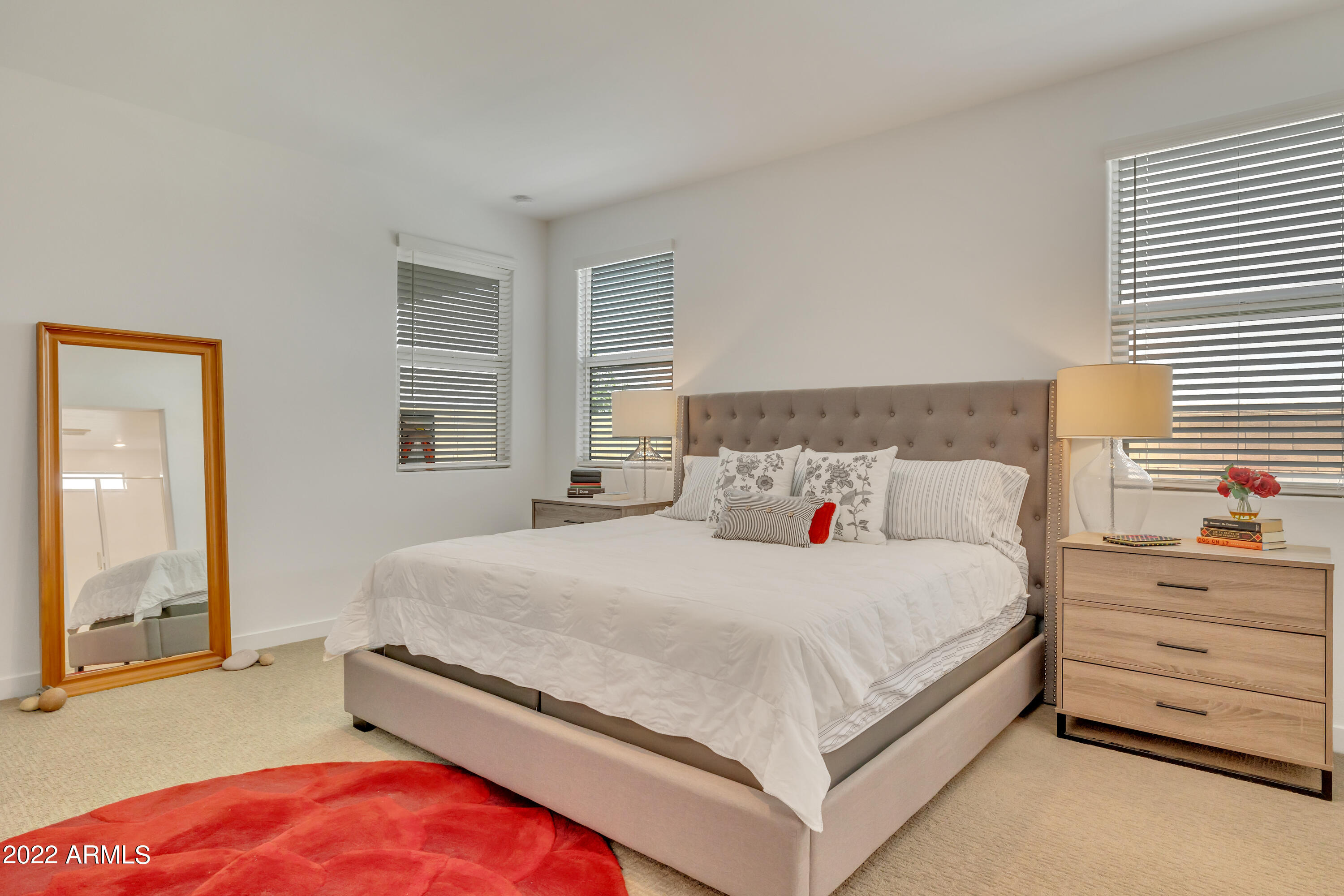 9630 West Atlantis Way Tolleson, AZ 85353 - Photo 15 of 37 a bedroom with a bed and a dresser