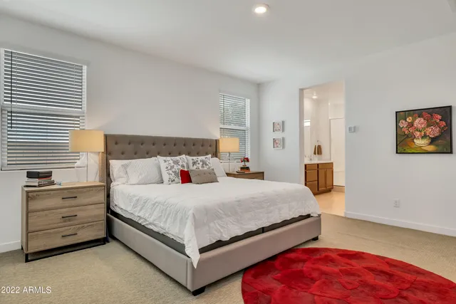 a bedroom with a bed and a dresser