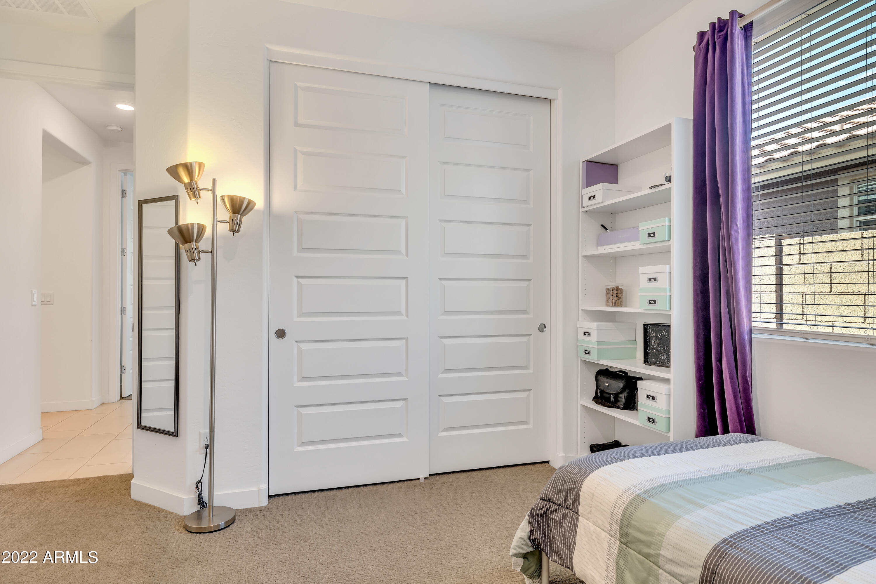 9630 West Atlantis Way Tolleson, AZ 85353 - Photo 24 of 37 a view of a bedroom with closet