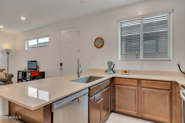 a kitchen that has a sink and a stove