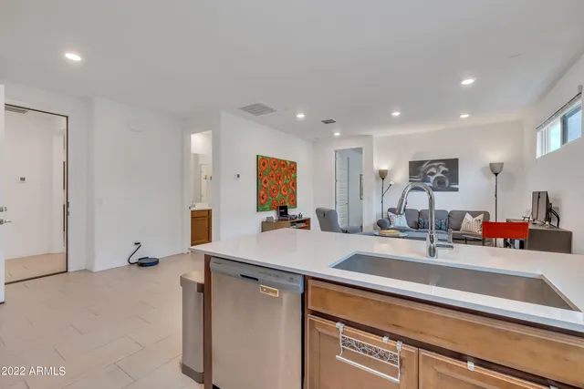 a room with sink and mirror