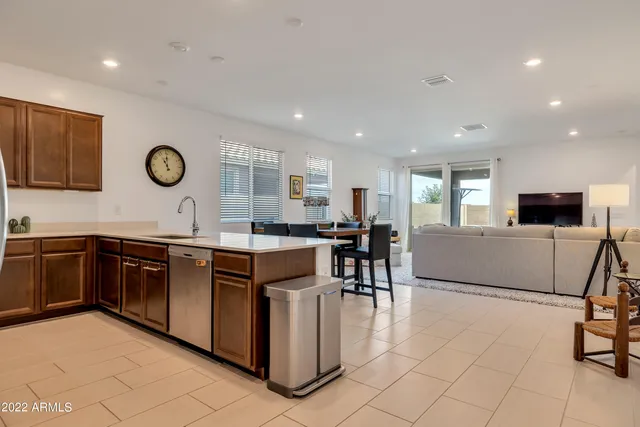a kitchen with granite countertop a sink and a stove top oven