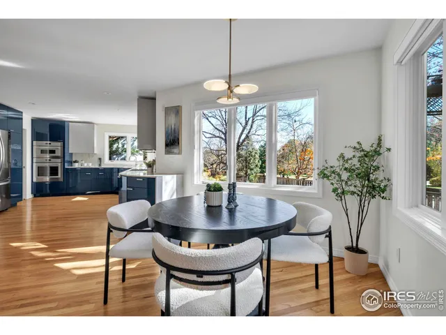a hallway view with wooden floor and furniture
