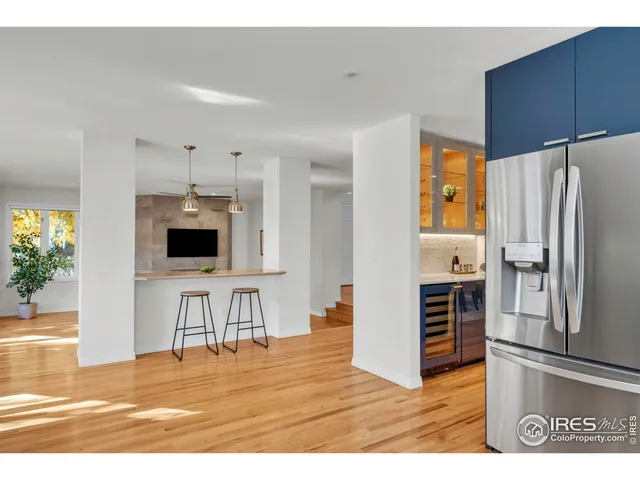 a living room with furniture and large windows