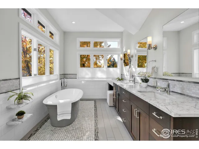a bathroom with a sink vanity and a mirror