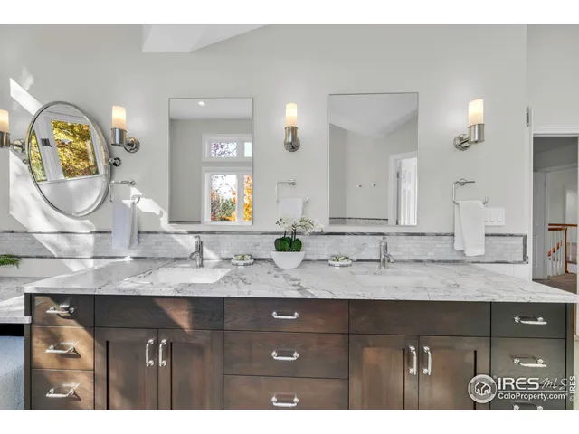 a view of a yard in front of a house with a large tree