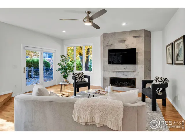 a view of a dining room with furniture wooden floor and chandelier