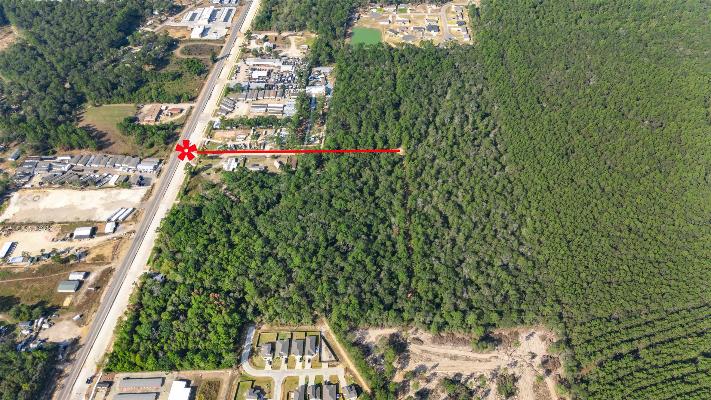 105 E/ Crowson Ridge Road Conroe, TX 77306 - Photo 8 of 16 a view of building and yard