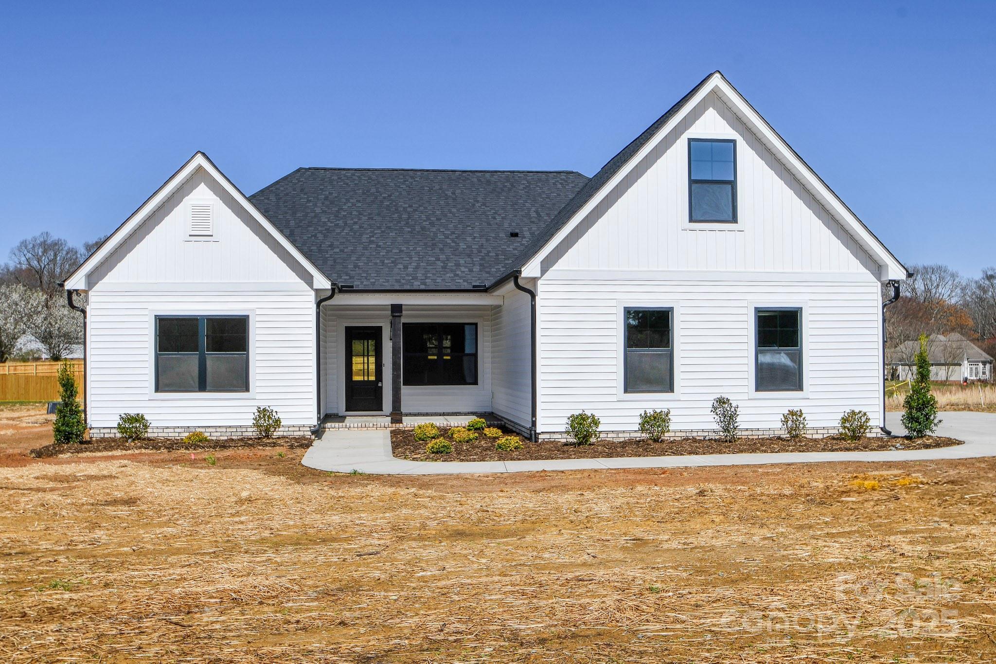 5411 East Lawyers Road Wingate, NC 28174 - Photo 1 of 22 a front view of house with yard