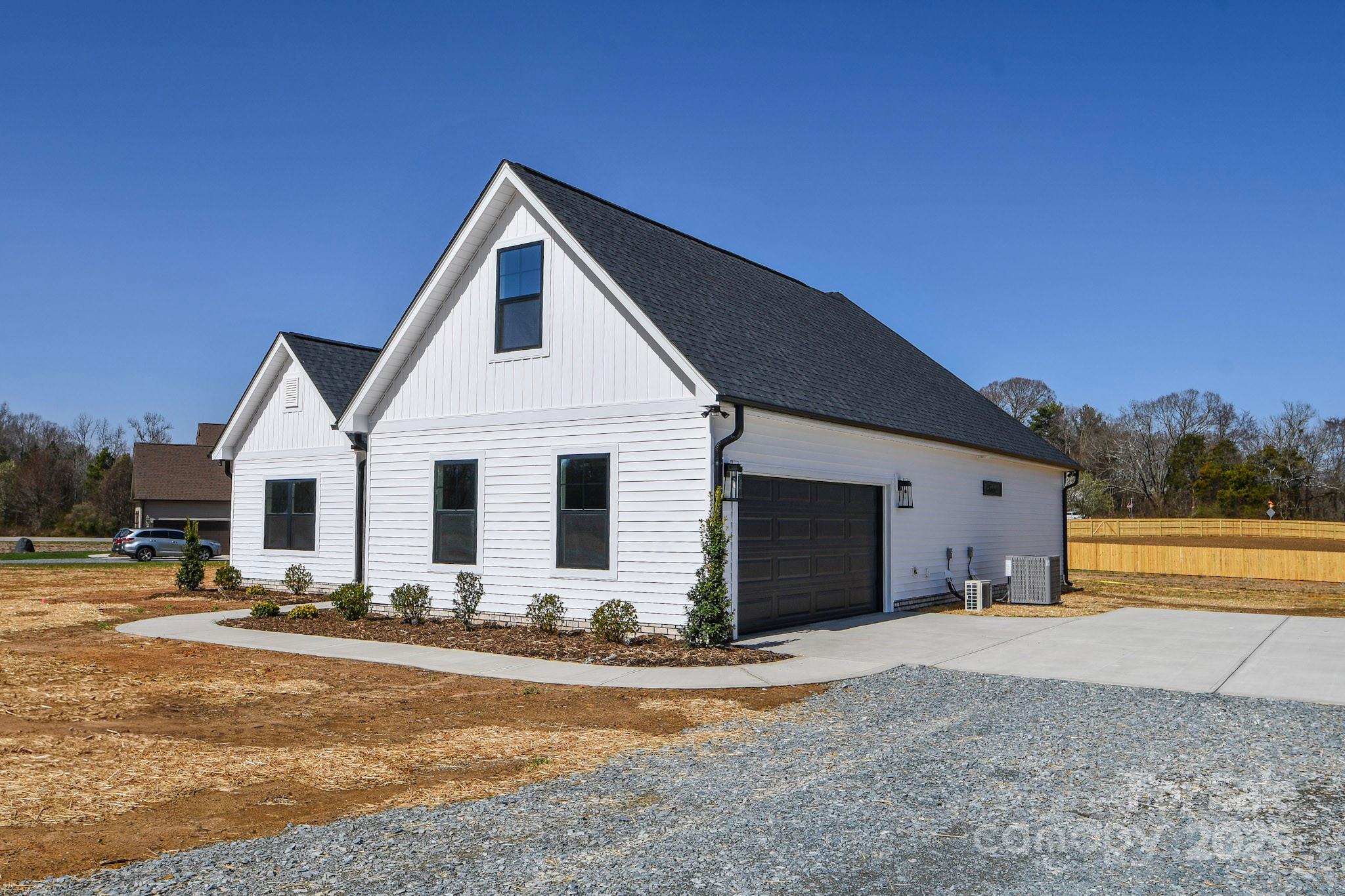 5411 East Lawyers Road Wingate, NC 28174 - Photo 3 of 22 a view of a house with outdoor space and ocean view