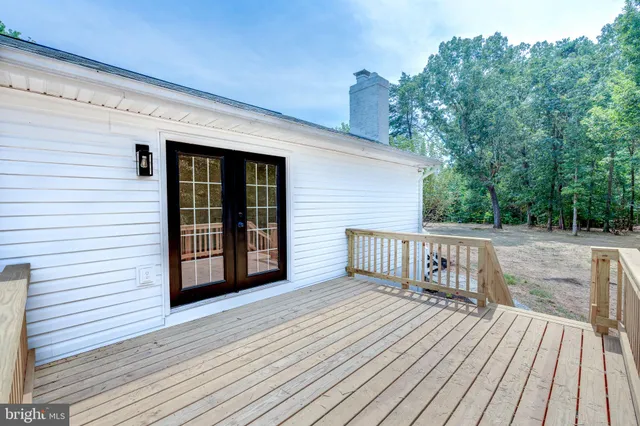 a view of deck with wooden floor and fence