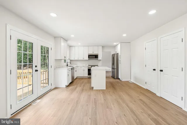 a view of kitchen with wooden floor