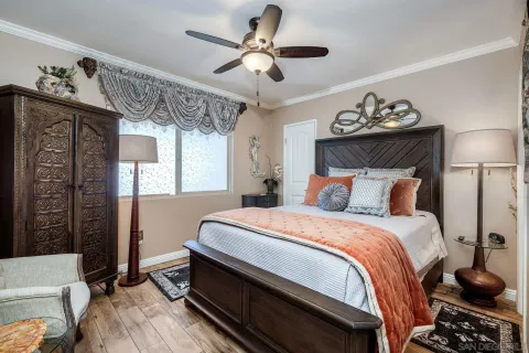 a bedroom with bed and window