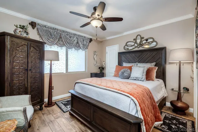 a bedroom with bed and window