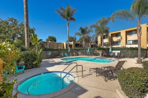a view of a swimming pool with a patio