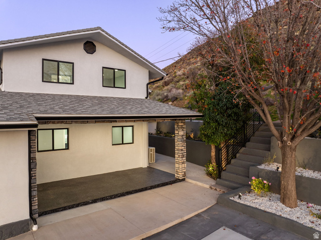 476 Spring Drive Toquerville, UT 84774 - Photo 77 of 95 View of front of home featuring stucco siding, a patio, and a shingled roof
