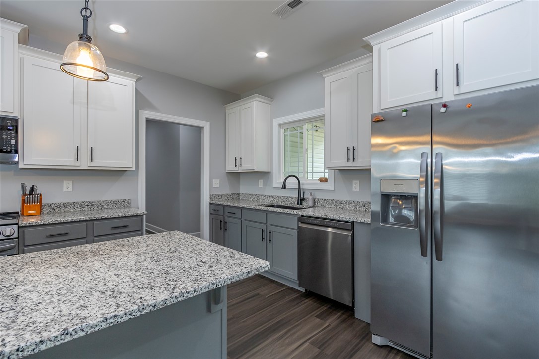 3080 McGee Road Iva, SC 29655 - Photo 9 of 49 Culinary delights await in this modern kitchen with ample counter space and stylish finishes.