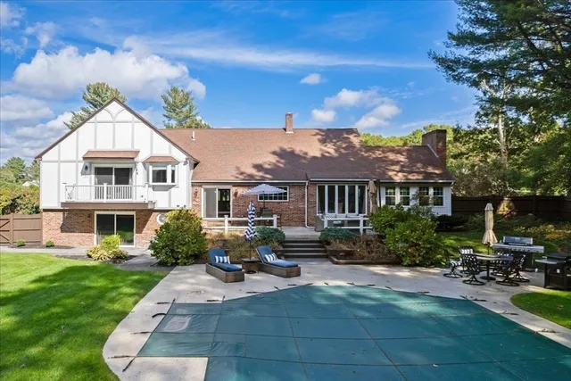 a front view of a house with yard patio and fire pit