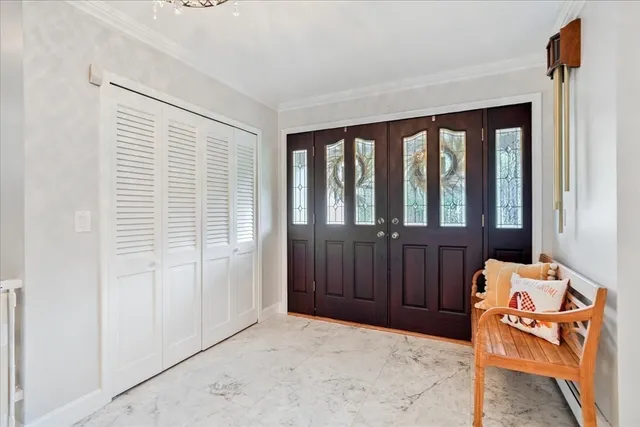 a view of a bedroom with furniture and windows
