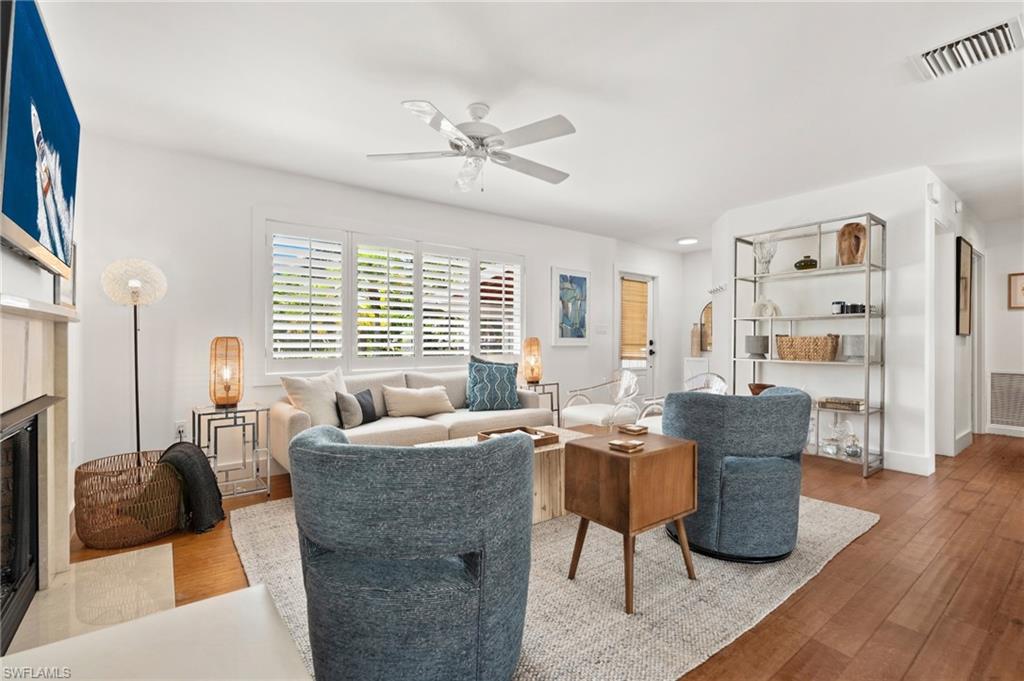 725 Central Avenue Naples, FL 34102 - Photo 3 of 10 a living room with furniture and a large window
