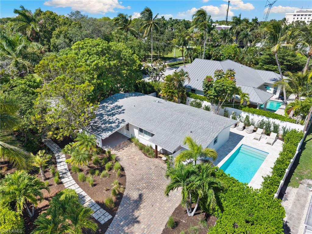725 Central Avenue Naples, FL 34102 - Photo 5 of 10 an aerial view of a house with a yard and lake view
