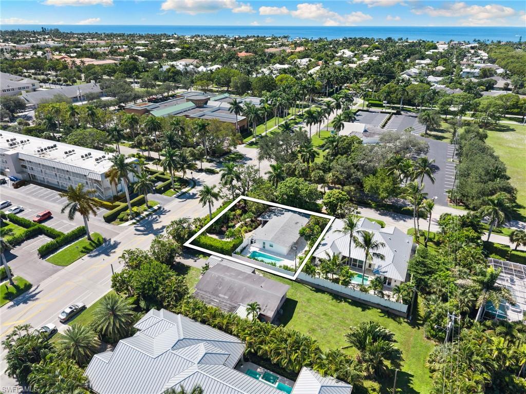 725 Central Avenue Naples, FL 34102 - Photo 7 of 10 an aerial view of residential houses with outdoor space
