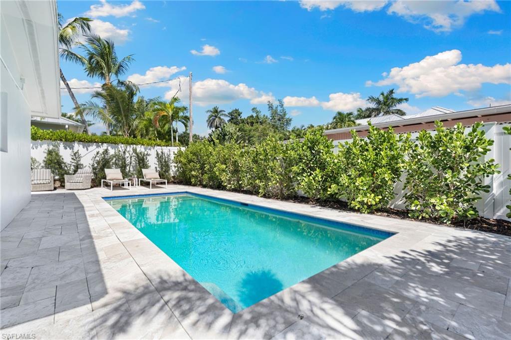 725 Central Avenue Naples, FL 34102 - Photo 8 of 10 a view of swimming pool