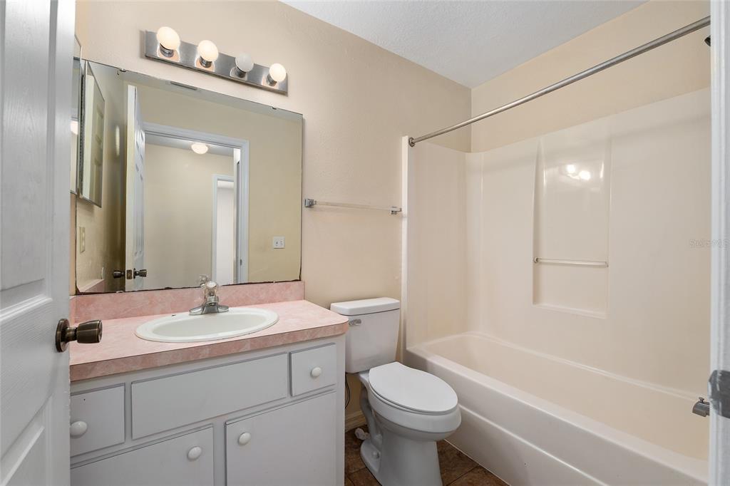 4329 Northwest 155th Street Reddick, FL 32686 - Photo 38 of 52 a bathroom with a sink a toilet and shower