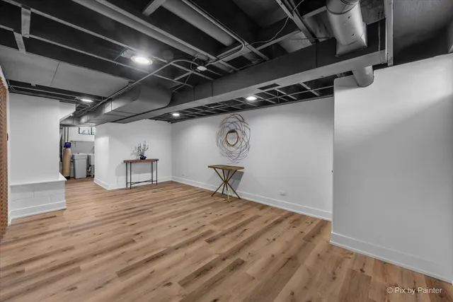 a view of a room with wooden floor