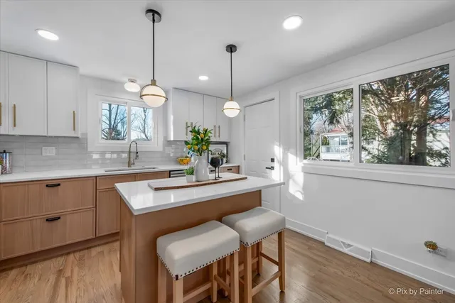 a kitchen with a table and chairs in it