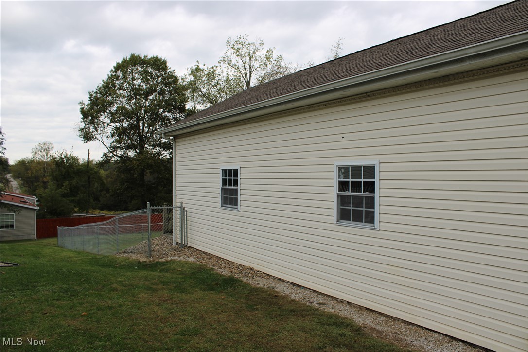 56 3rd Street Rayland, OH 43943 - Photo 8 of 46 View of side of property with roof with shingles