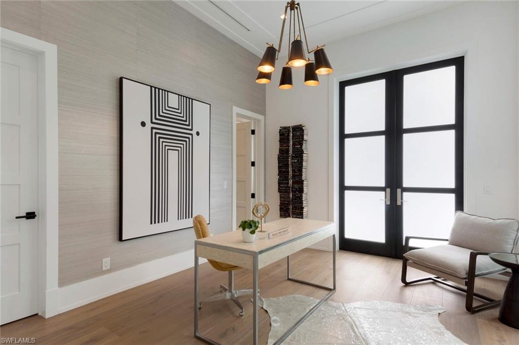 1430 Crayton Road Naples, FL 34102 - Photo 13 of 34 a living room with furniture and a window