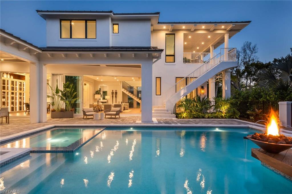 1430 Crayton Road Naples, FL 34102 - Photo 31 of 34 a view of a living room and chandelier