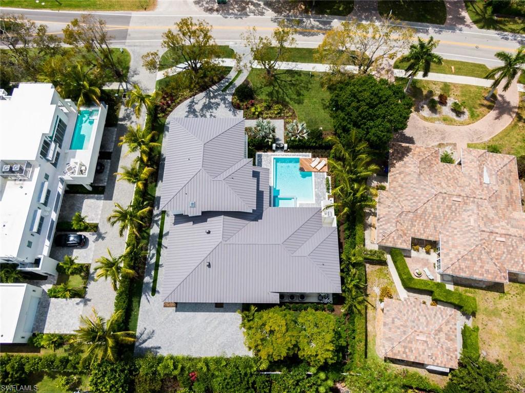 1430 Crayton Road Naples, FL 34102 - Photo 33 of 34 an aerial view of a house with yard swimming pool and outdoor seating