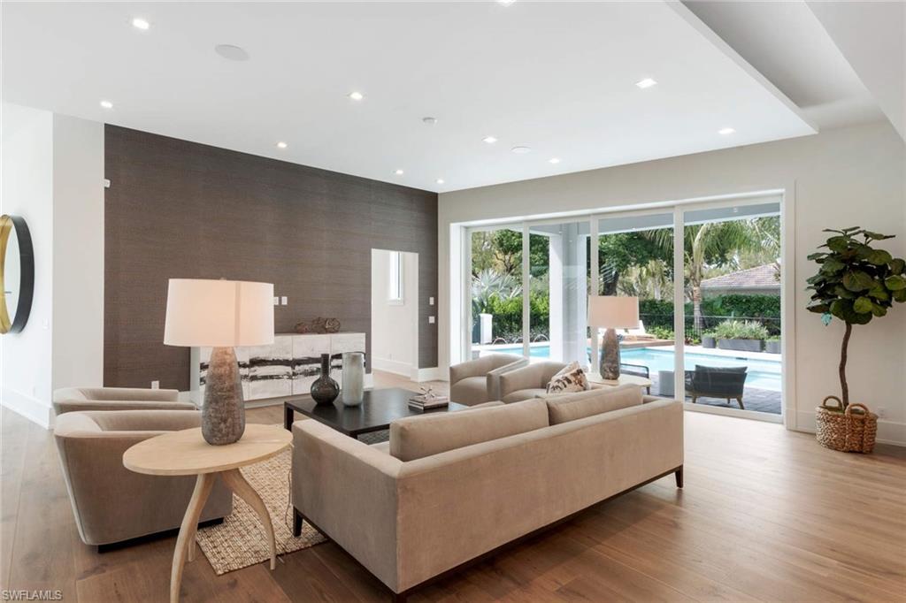 1430 Crayton Road Naples, FL 34102 - Photo 5 of 34 a living room with furniture and a large window