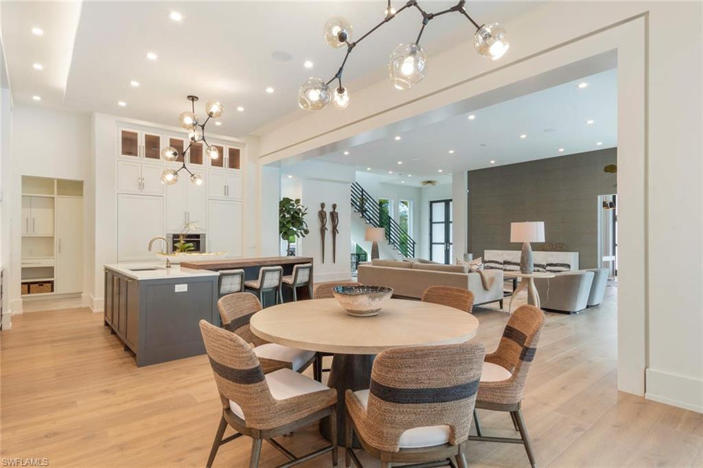 1430 Crayton Road Naples, FL 34102 - Photo 10 of 34 a kitchen with a table and chairs in it