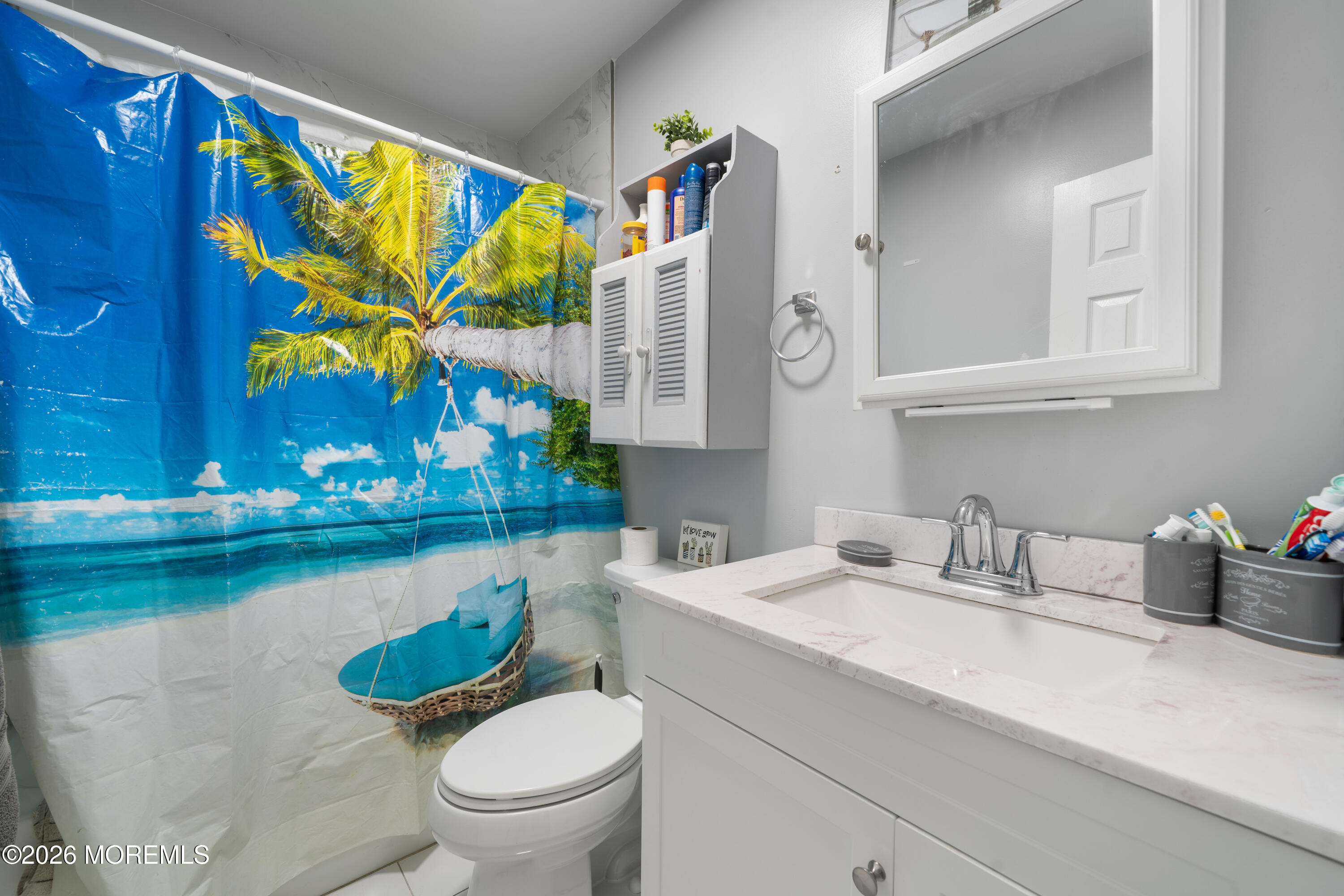 612 Nantucket Road Forked River, NJ 08731 - Photo 12 of 22 a bathroom with a sink a toilet and a mirror