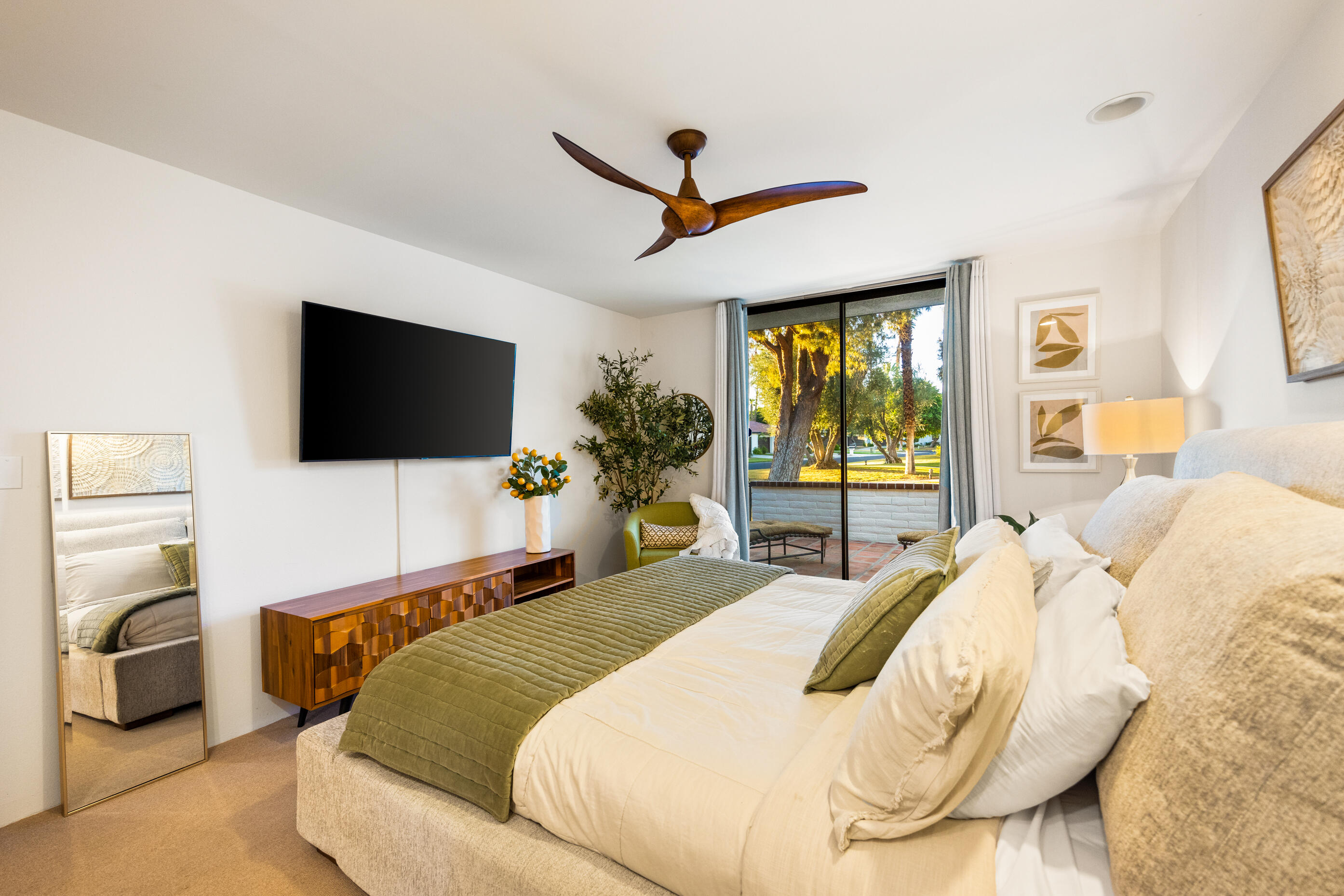 60 El Toro Drive Rancho Mirage, CA 92270 - Photo 14 of 38 a bedroom with a bed flat screen tv and a large window