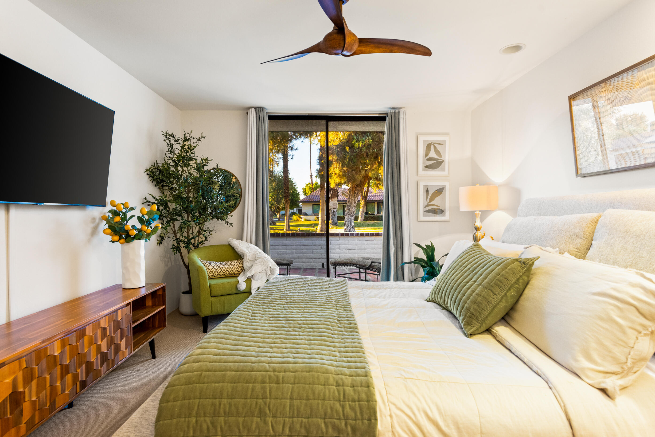 60 El Toro Drive Rancho Mirage, CA 92270 - Photo 18 of 38 a bedroom with a bed and a flat screen tv