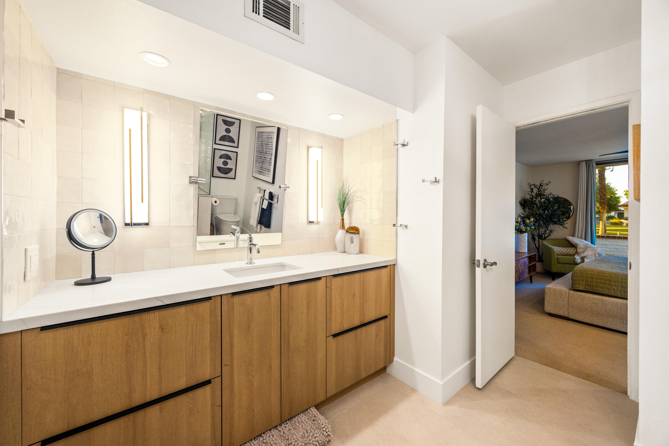 60 El Toro Drive Rancho Mirage, CA 92270 - Photo 21 of 38 a en suite bathroom with double sink and a mirror