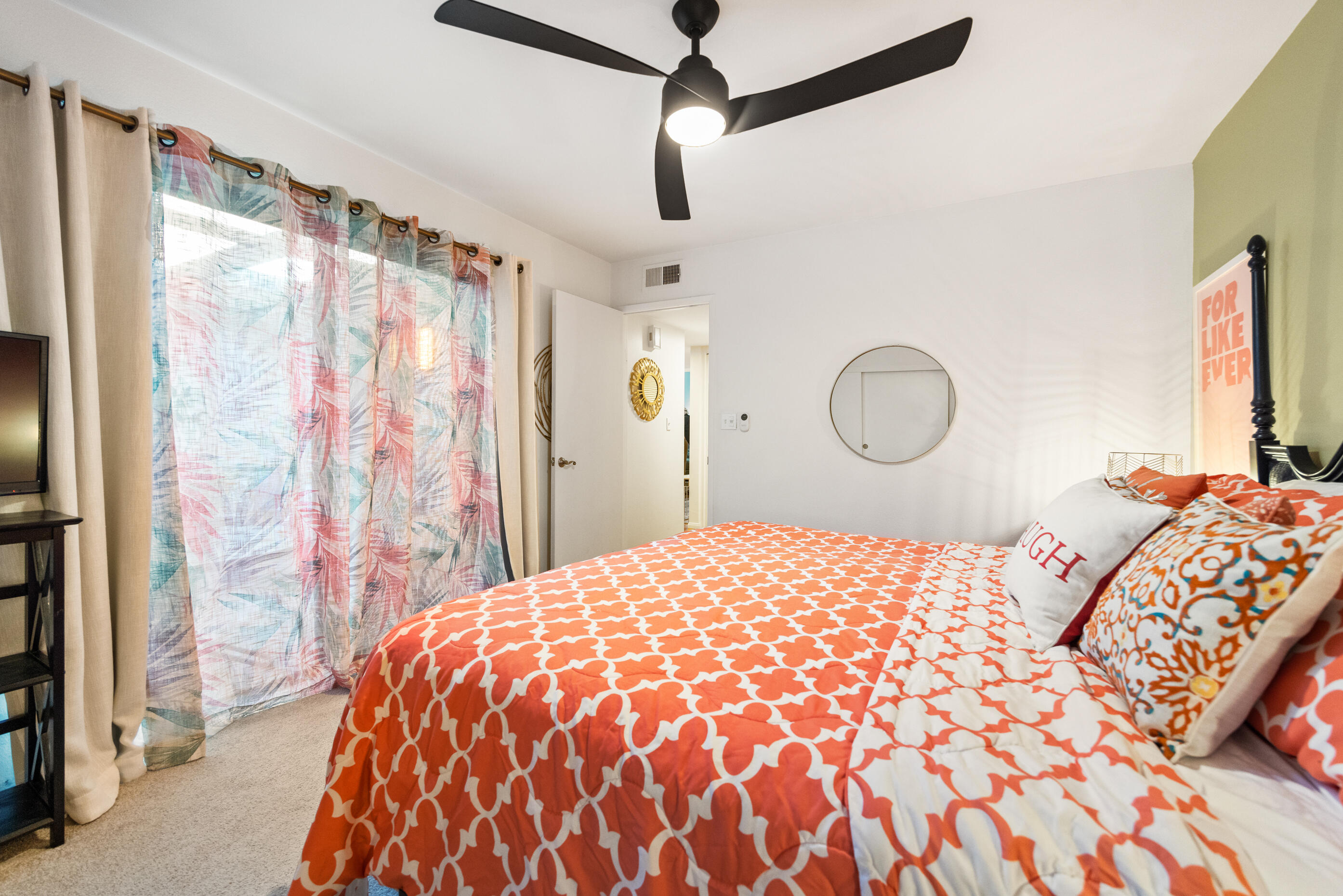 60 El Toro Drive Rancho Mirage, CA 92270 - Photo 24 of 38 a bedroom with a large bed and a chandelier